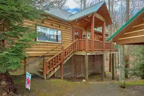 a log cabin with a large wooden deck at Park Paradise #254 in Sevierville