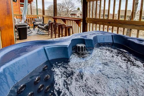 a hot tub on the deck of a house at River Elegance #2335 in Pigeon Forge