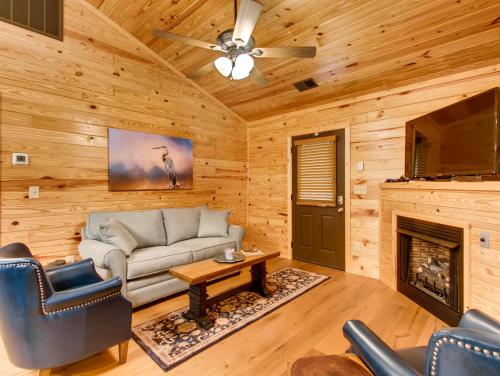 a living room with a couch and a fireplace at River Getaway #2326 in Pigeon Forge