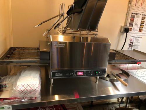 a microwave oven sitting on top of a counter at Gators Inn on the Bayou in Larose