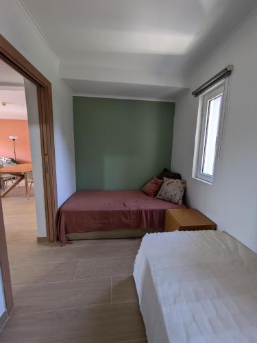 a bedroom with two beds and a table at Private Lake Condo Apartment - Tróia in Troia