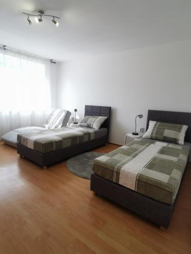 Postel nebo postele na pokoji v ubytování Apartment Tonio - right on the main square