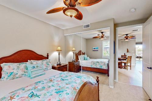 Ένα ή περισσότερα κρεβάτια σε δωμάτιο στο The Golf Villas at Mauna Lani E3