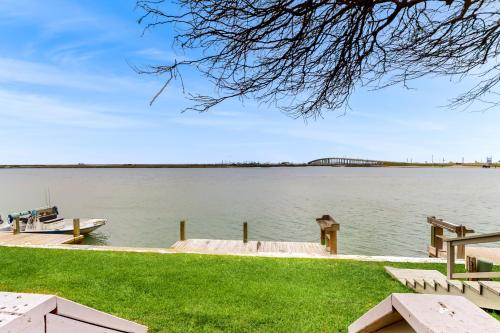 a view of a lake with a bridge in the background at Puente Vista 106 in Padre Island