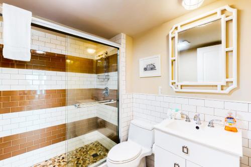 a bathroom with a shower and a toilet and a sink at Puente Vista 106 in Padre Island