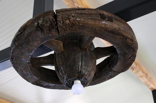 a large wooden fan hanging from a ceiling at Domacinstvo na kraju svijeta in Šipovo