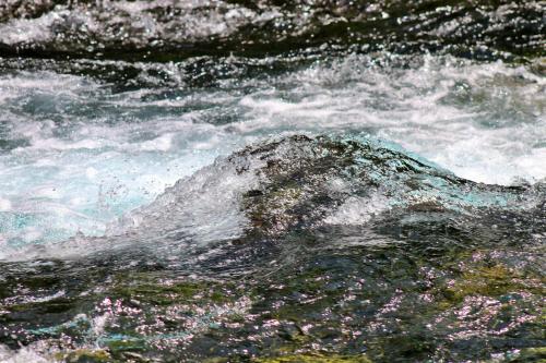 a rock in the middle of a stream of water at Domacinstvo na kraju svijeta in Šipovo