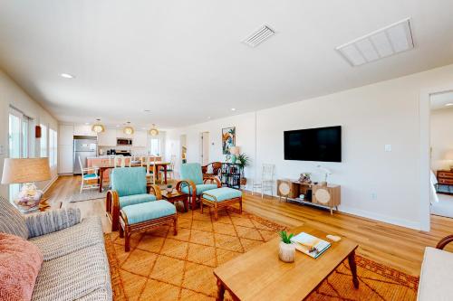 a living room filled with furniture and a flat screen tv at Kermit's Place in Fort Morgan