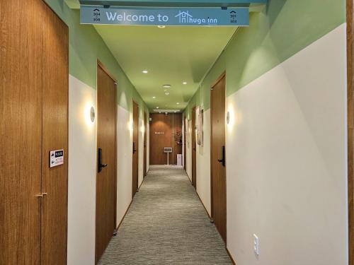 a hallway with a sign that reads welcome to thurgoland at Huga Inn in Seoul