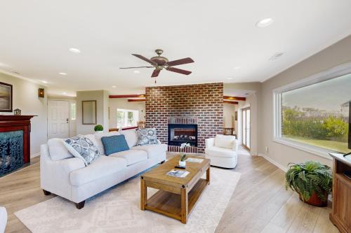 a living room with a couch and a fireplace at Silver Point in Ocean City