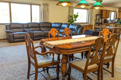 a living room with a wooden table and chairs at A Helena Haven in Helena