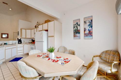 a kitchen and dining room with a table and chairs at Rocky Shore Reflection in Kimberling City