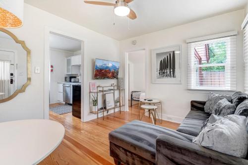 a living room with a couch and a table at Vintage Tiny House CUTE 1BDRM Big Appeal in Colorado Springs