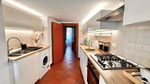 a kitchen with a sink and a stove top oven at Luna Prime Collection Catania in Catania