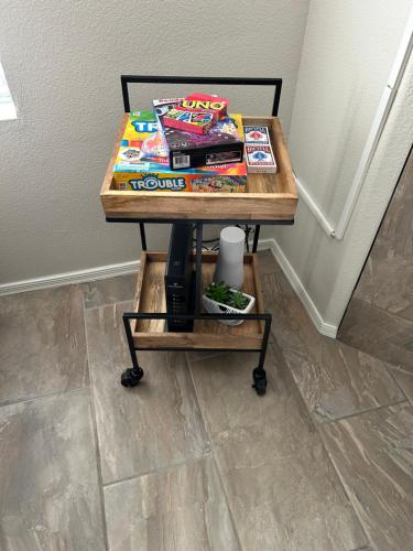 a table with books and magazines on it at Stay in Style Scottsdale 1st Floor Condo in Scottsdale