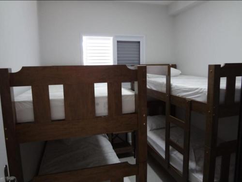 Postel nebo postele na pokoji v ubytování Apartamento Ubatuba, Itagua, Condominio Edificio Villa Monreale, E-12