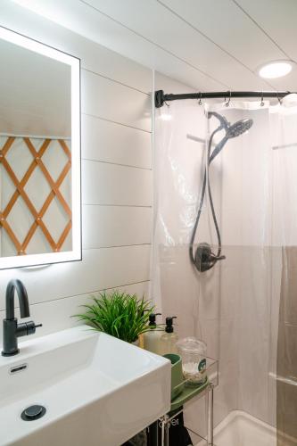 a bathroom with a sink and a shower at Purple City Retreats - Luxury Yurt & Spa in Portland