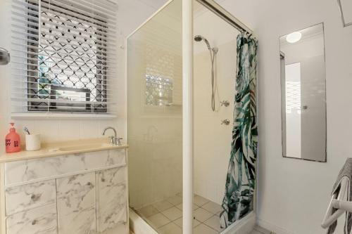 a bathroom with a shower and a sink at Edmund Street 47, Shelly Beach in Caloundra