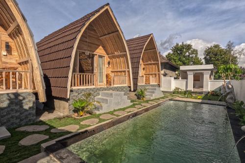 an image of a house with a swimming pool at Samsara Desa in Kintamani