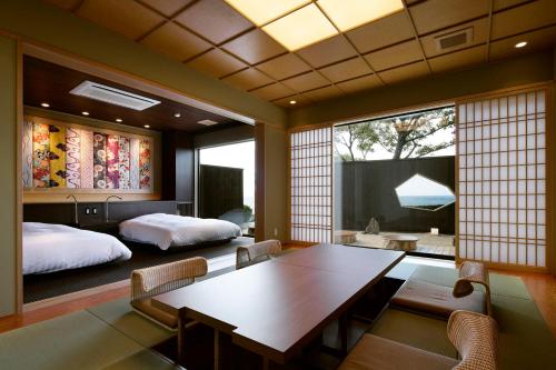 Cama o camas de una habitación en 間人温泉 炭平