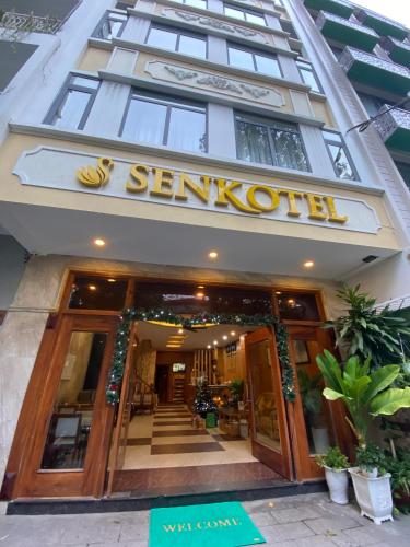 a building with a sign that reads sentosa at Senkotel Nha Trang Managed by NEST Group in Nha Trang