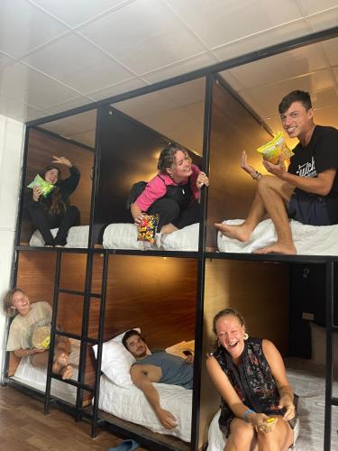 a group of people sitting in bunk beds at Pea Hostel in Sa Pa