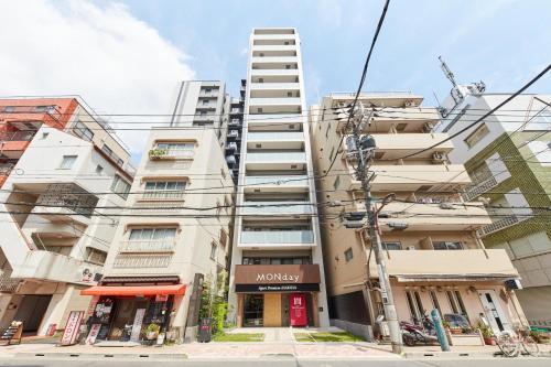 an apartment building with a ladder on the side of it at MONday Apart Premium Asakusa in Tokyo