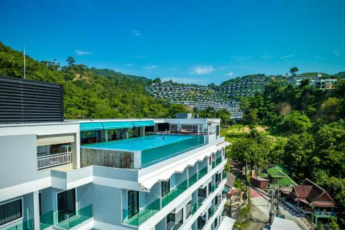 an aerial view of a building with a swimming pool at Triple L Hotel Patong Beach Phuket in Patong Beach
