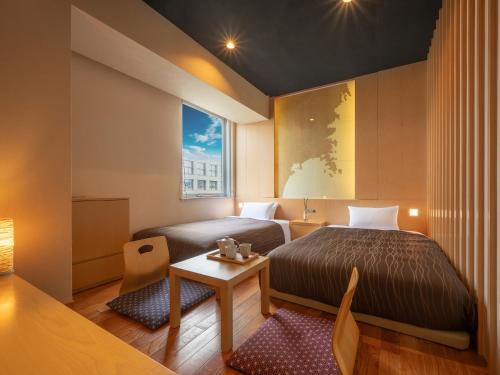 Ένα ή περισσότερα κρεβάτια σε δωμάτιο στο Sendai Washington Hotel