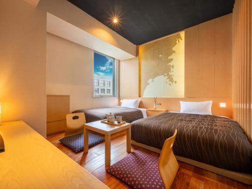 Ένα ή περισσότερα κρεβάτια σε δωμάτιο στο Sendai Washington Hotel