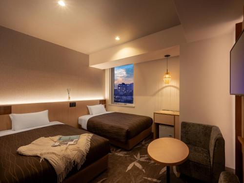 Ένα ή περισσότερα κρεβάτια σε δωμάτιο στο Sendai Washington Hotel