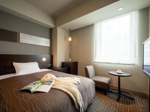 Ένα ή περισσότερα κρεβάτια σε δωμάτιο στο Sendai Washington Hotel
