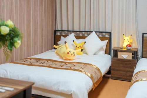 a bedroom with a bed with stuffed animals on it at Room 201 - Itabashi Minamicho - Diamond Yu in Tokyo