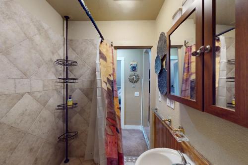 a bathroom with a shower with a toilet and a sink at Provincetown Bliss in Provincetown