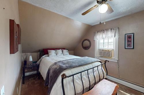 a bedroom with a bed and a ceiling fan at Provincetown Bliss in Provincetown