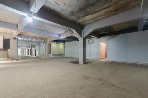 an empty room with white walls and concrete floors at My home2 Mall Ciputra Cibubur Redpartner in Kranggan-wetan Satu