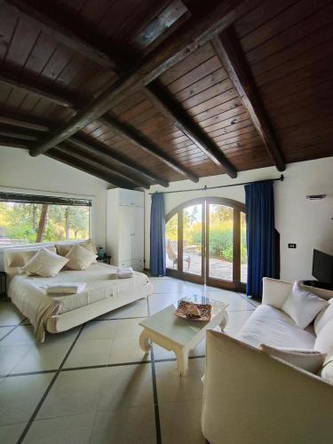 a large living room with two beds and a couch at Maison Du Reve Scario in Scario