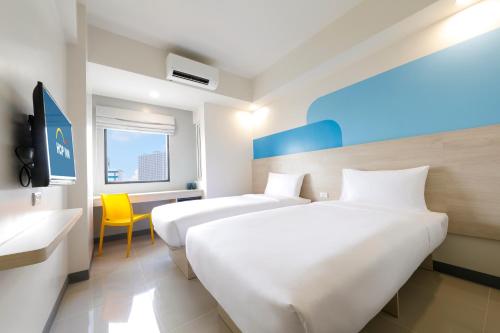 Postel nebo postele na pokoji v ubytování Hop Inn Hotel Davao
