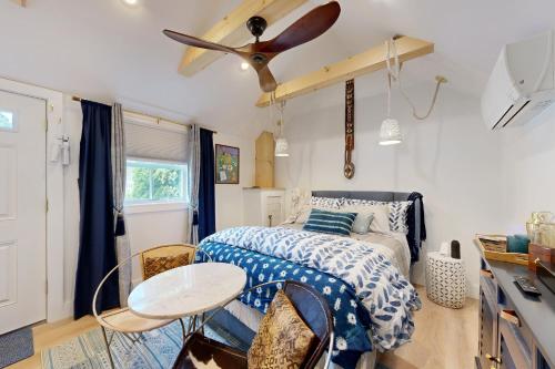 a bedroom with a bed and a ceiling fan at Sankofa Studio in Oak Bluffs