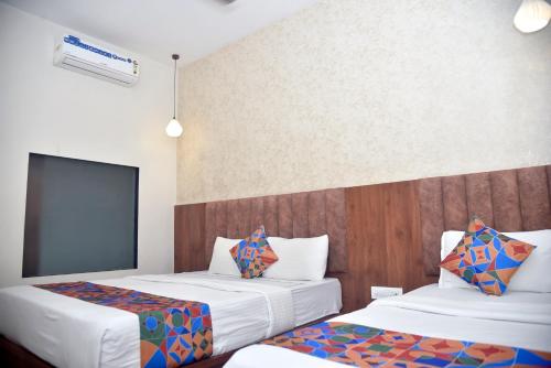 Postel nebo postele na pokoji v ubytování Hotel Pride Inn