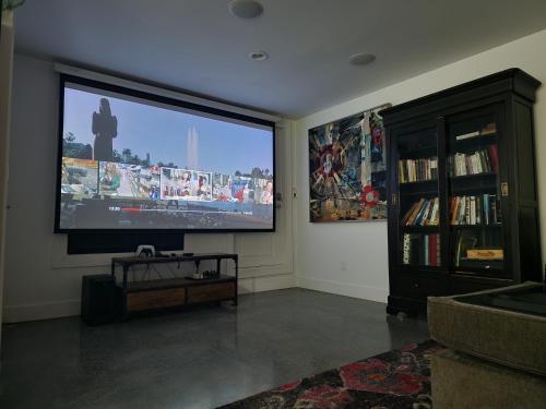 a living room with a large flat screen tv at 2BD Guest Suite Sleeps 6 Near Downtown & Beach in West Vancouver