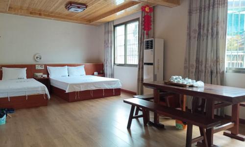 Postel nebo postele na pokoji v ubytování Chenkun Guesthouse