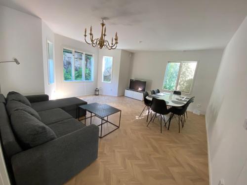 a living room with a couch and a table at Apart City Rentals in Gothenburg
