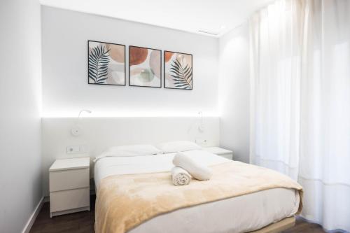 Postel nebo postele na pokoji v ubytování Apartamentos Turísticos Metropolis by CartagenaSpain