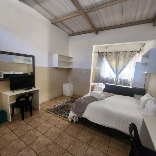 Katil atau katil-katil dalam bilik di Sunny Lodge