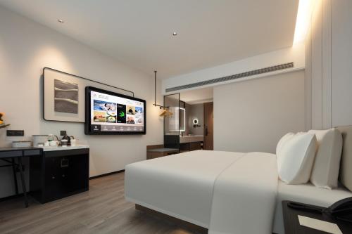 Μια τηλεόραση ή/και κέντρο ψυχαγωγίας στο Atour Hotel Quanzhou Dehua