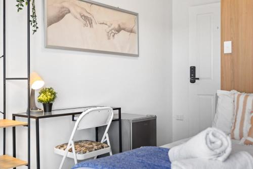 a bedroom with a desk and a chair next to a bed at Cozy Private Single Room in Bankstown - Near Transport & Shops - Shared Bathroom in Bankstown