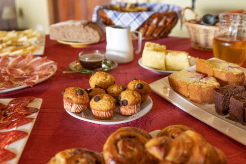 a table topped with different types of pastries and cakes at Casa Rural Zigako Etxezuria in Ziga