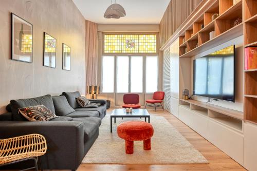 Posezení v ubytování Luxueux Logement Design 4 ch Climatisé