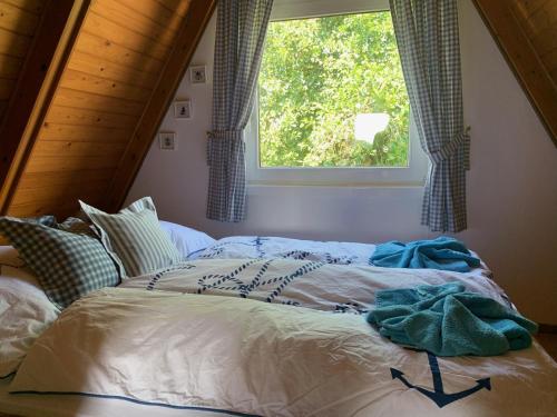 Ένα ή περισσότερα κρεβάτια σε δωμάτιο στο Ferienhaus am Meer